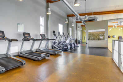 Fitness center with row of treadmills