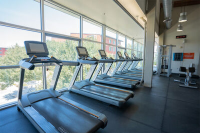 Fitness center with row of treadmills