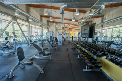 Fitness center with cardio equipment and weighs