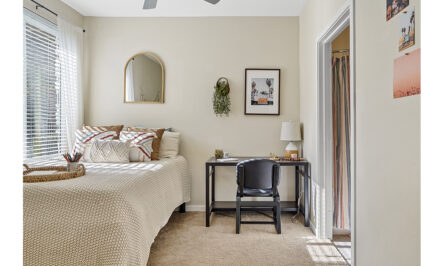 Bedroom furnished with a bed and desk
